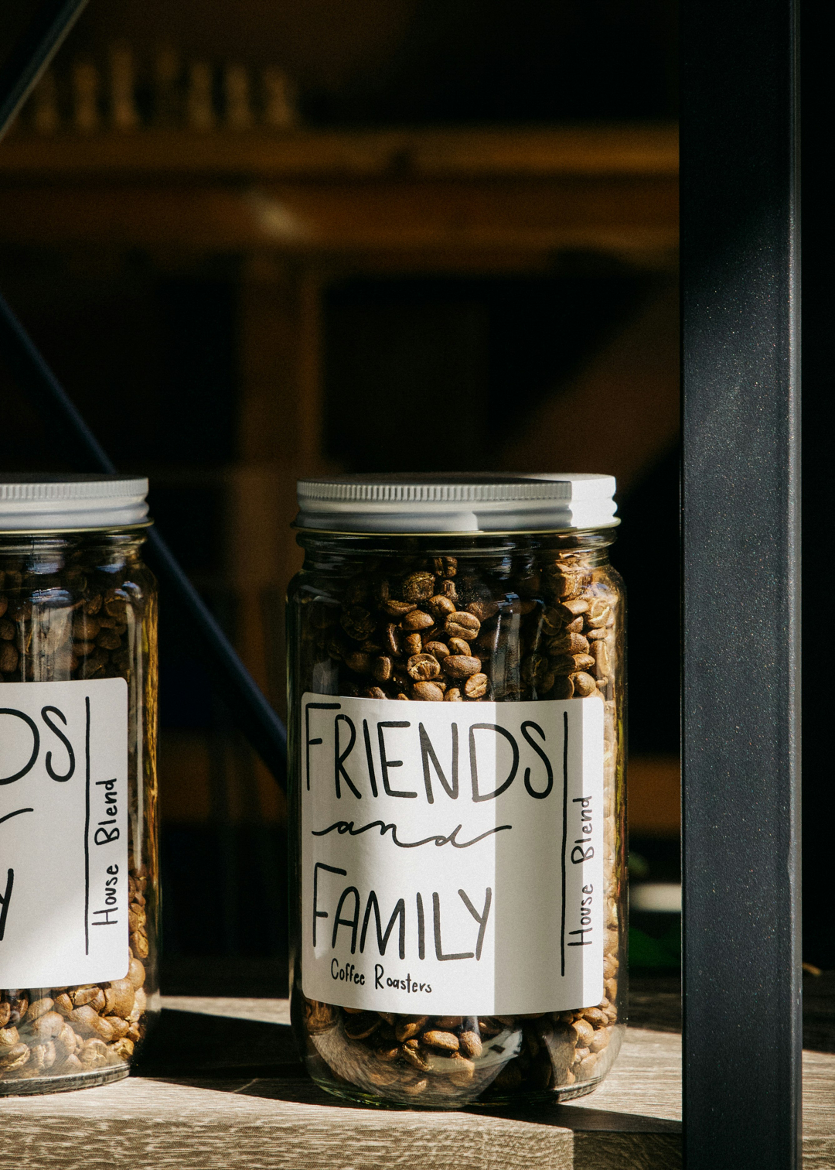 two clear glass condiment shakers